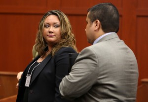 Shellie Zimmerman, left, looks at her husband George Zimmerman as they leave the court room during a recess in his trial at Seminole circuit court in Sanford, Fla., Friday, June 14, 2013. Zimmerman has been charged with second-degree murder for the 2012 shooting death of Trayvon Martin.(AP Photo/Orlando Sentinel, Gary W. Green, Pool)